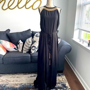 Black maxi dress with gold detail. Side slits for easy walking & with a tie